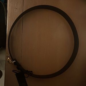 Black Versace belt with a gold buckle